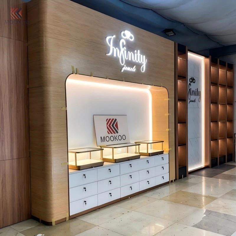 Customized Modern Rotating Metal Jewelry Display Cabinet LED Light Luxury Boutique Jewelry Store Fixture Side Table suppliers